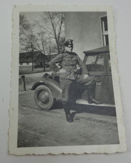 Photograph of WaffenSS soldier with a vehicle