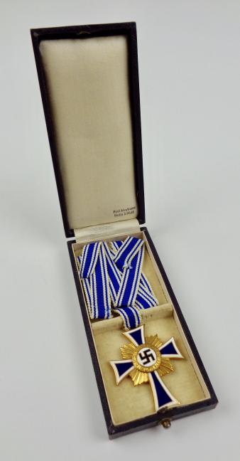 Mothers Cross in gold in its original case.