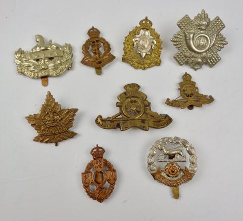 9 British and Canadian WW2 metal Cap Badges