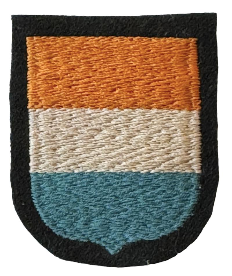 Dutch WaffenSS Sleeve Shield 23th Pz. Gren. Div. Nederland Mint Dachau made Dutch WaffenSS volunteer sleeve shield of the 23th WaffenSS Panzer Grenadier Division “Nederland” impossible to upgrade!