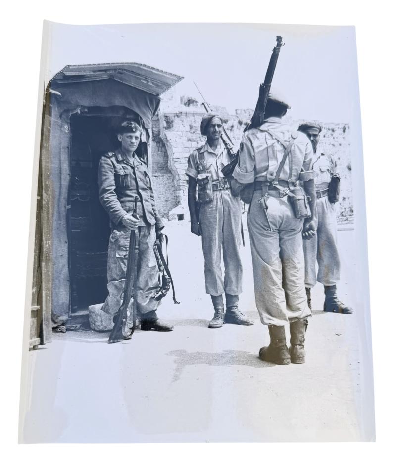 Very nice photograph of Kriegsmarine Costal Artillery Soldier holding guard with British Soldiers