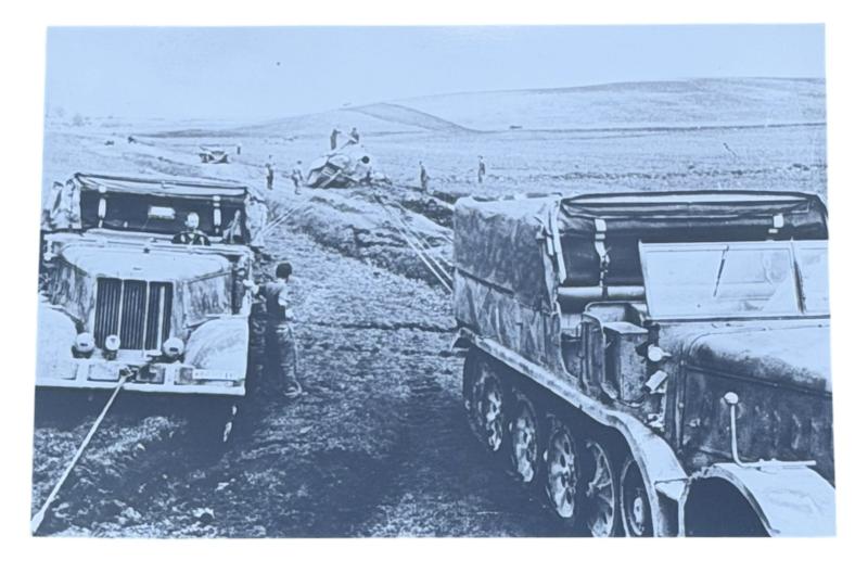 Very nice photograph of 2 Wehrmacht Tracked Vehikels towing a Panther Tank
