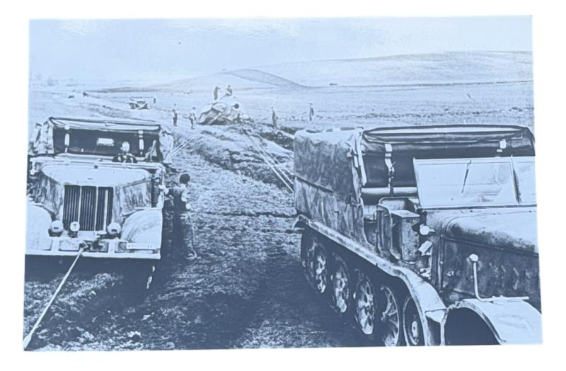 Very nice photograph of 2 Wehrmacht Tracked Vehikels towing a Panther Tank